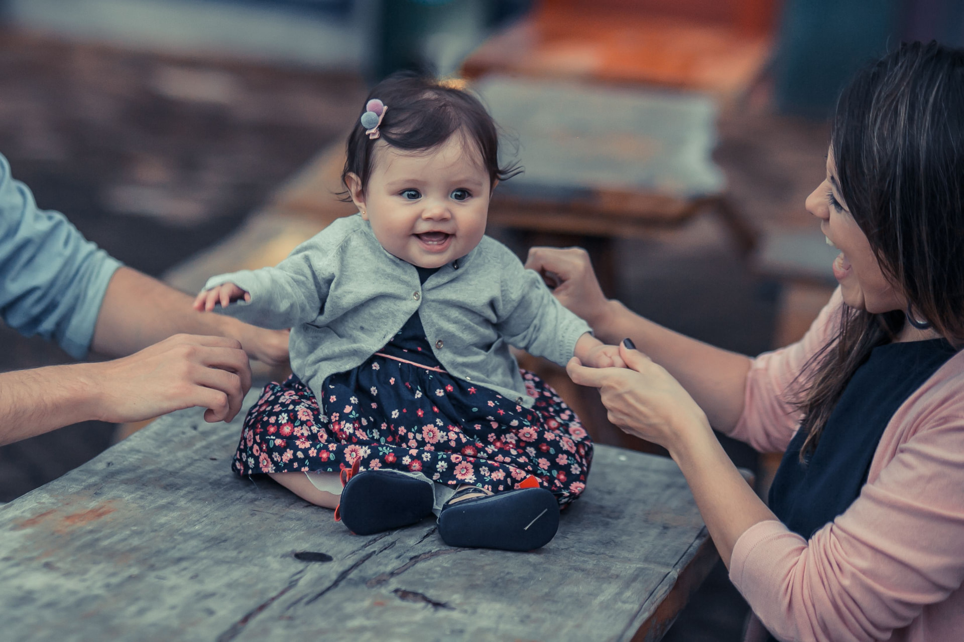 Parents playing with their smiling baby